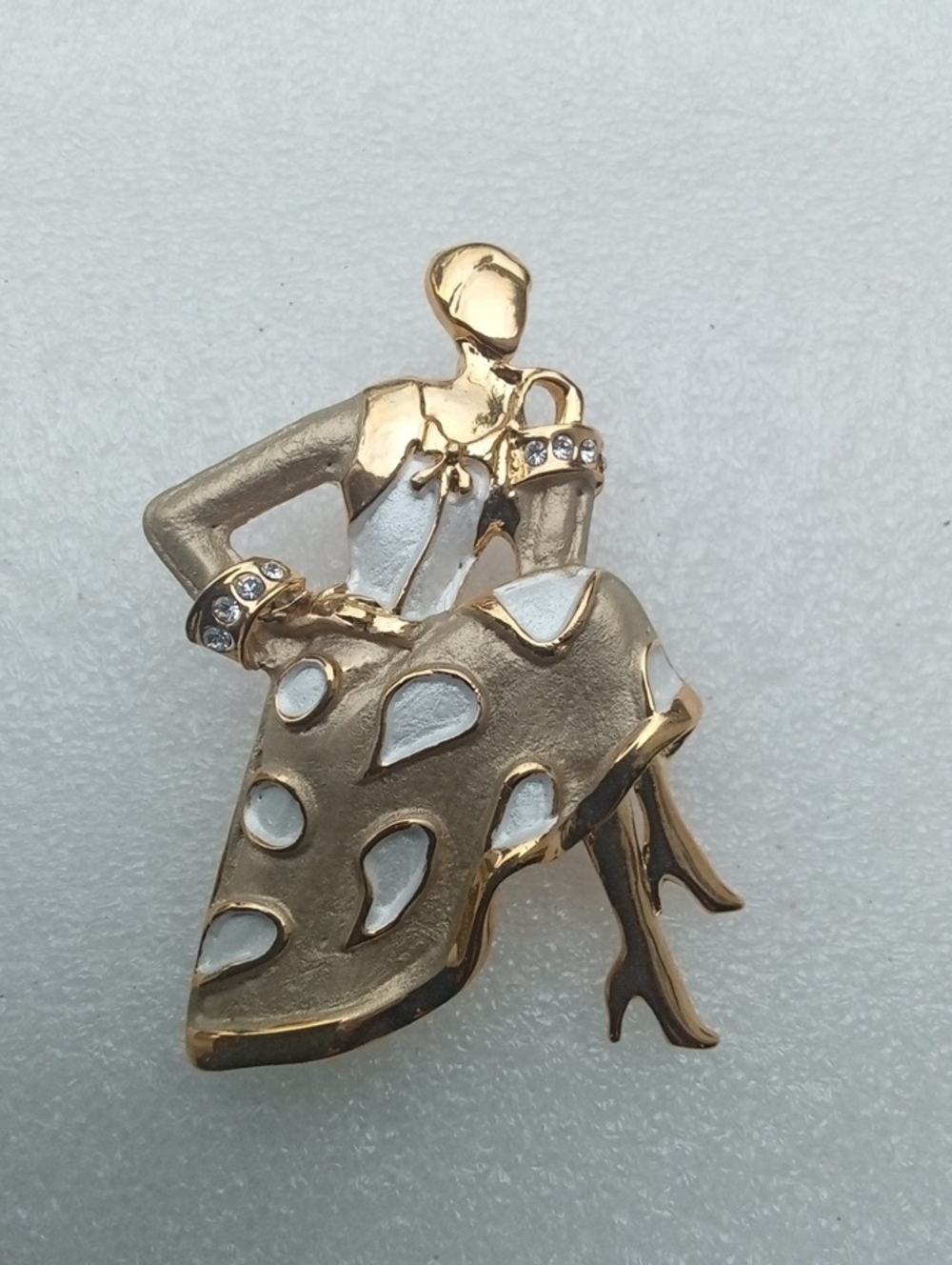 Gold Tone and White Enamel Dancer Brooch Feturing Sparkling Rhinestones Cuffs